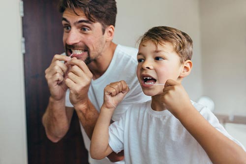 father-son-flossing