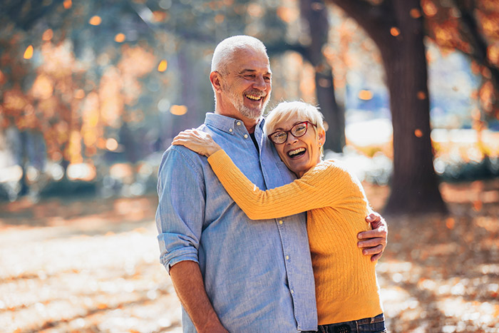 Senior Couple Laughing in Park