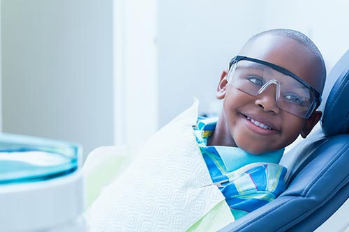 smiling-boy-waiting-for-dental-exam