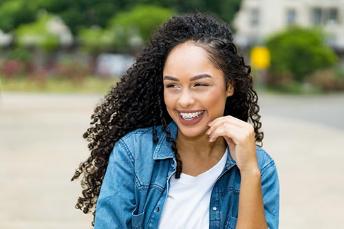 young-woman-smiling-outside-wearing-braces